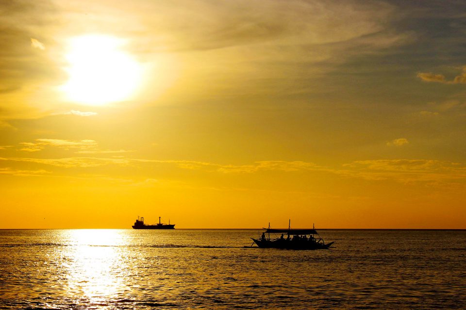 Boats silhouettes at sunset