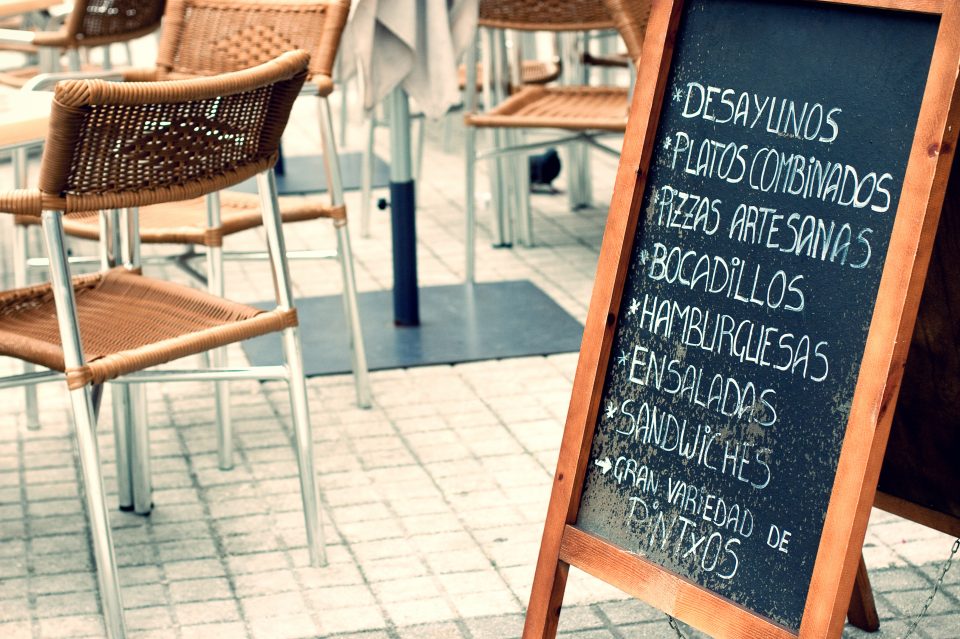 A menu board with spanish writing