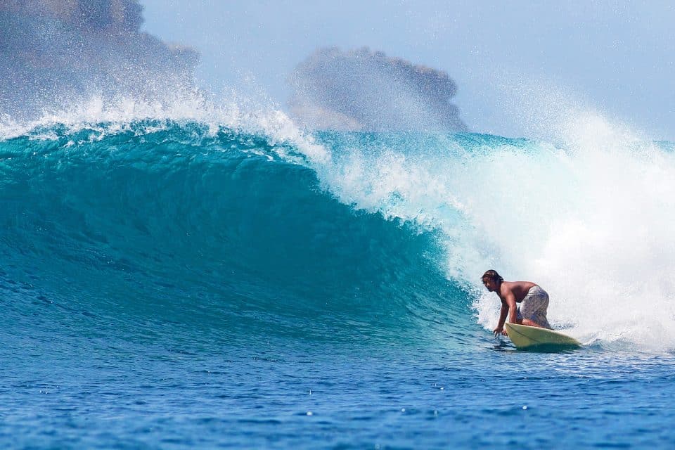 Surfing at beach on Lombok, Indonesia