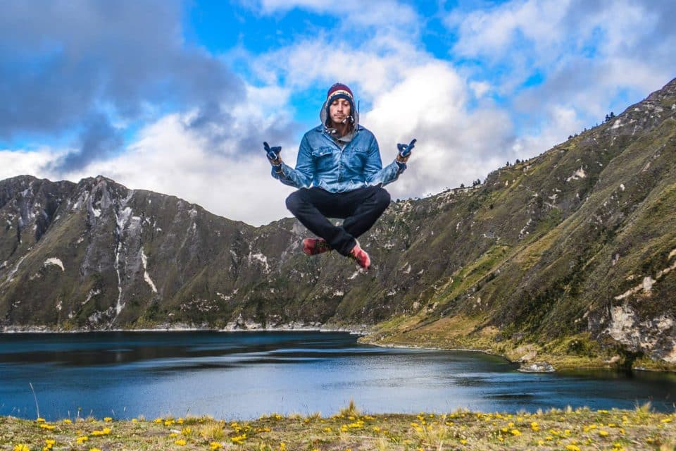 Jared Reichbaum floating above a lake