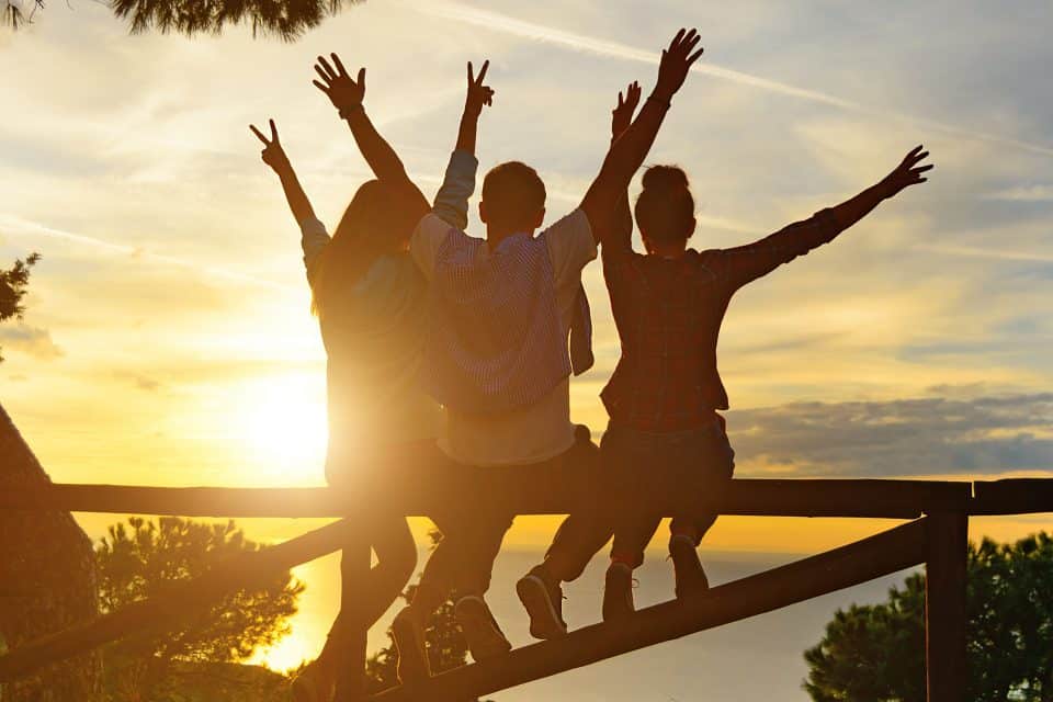 A group of people watching the sunset