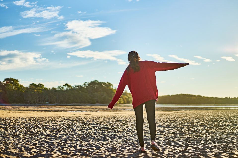 A woman walking on the beach