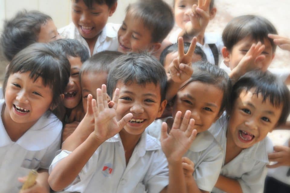 A group of local school children posing