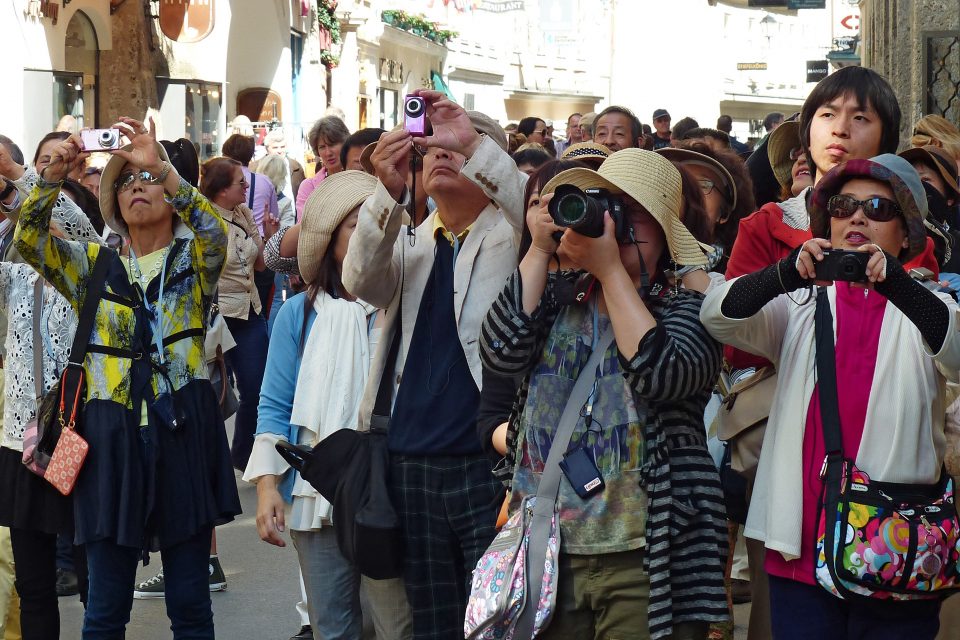 A group of Asian tourists taking photos