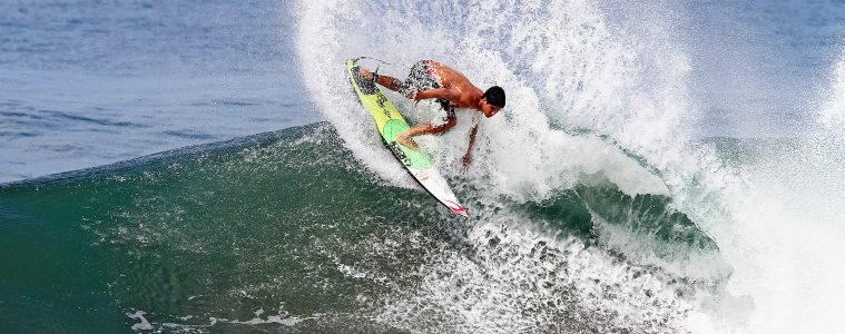 A man surfing in Keramas