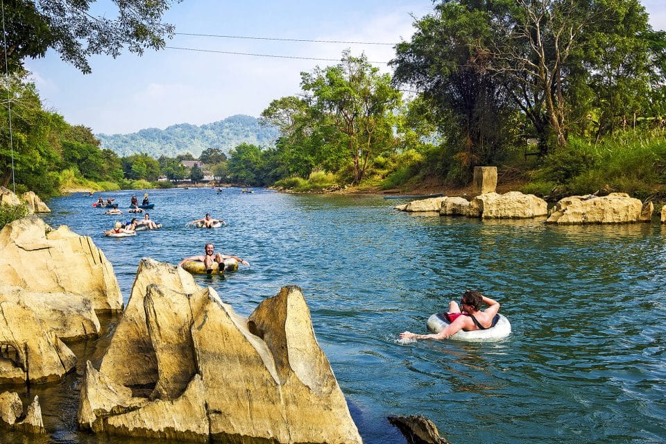 A group of people water tubing