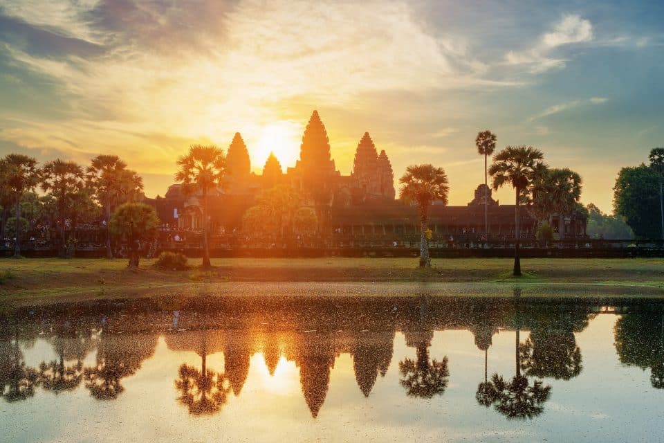 A temple on a lake at sunrise