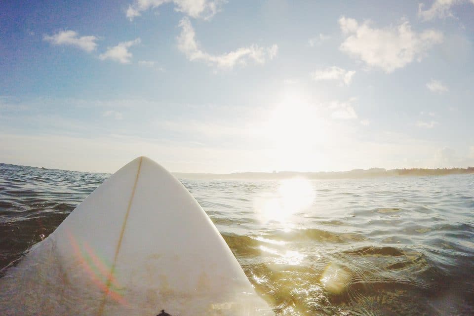 man surfboard ocean