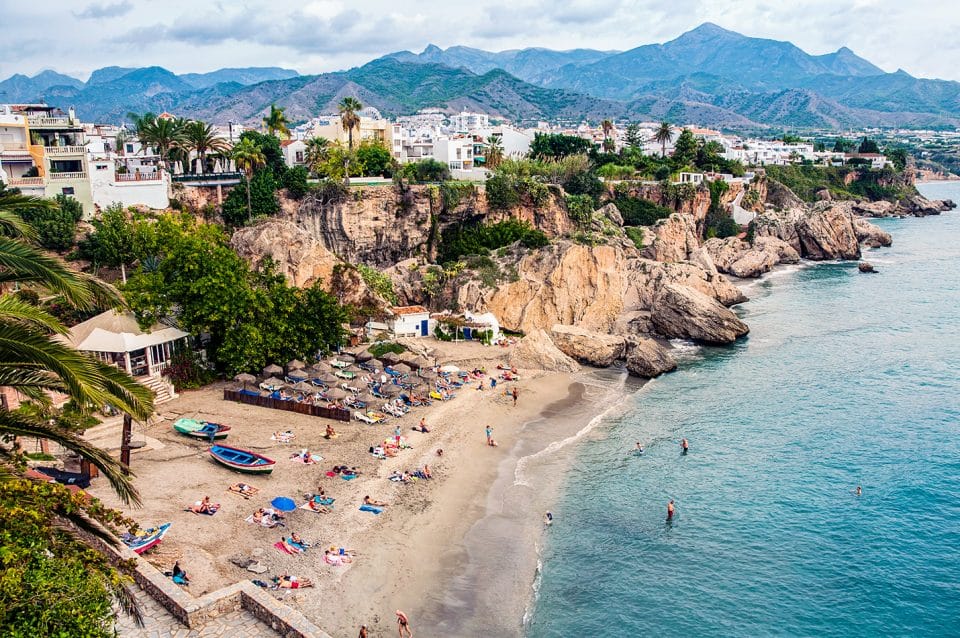 Houses on the coast with a cove below