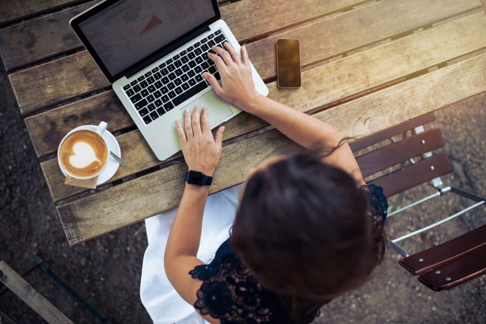 Aerial view of a woman and a laptop