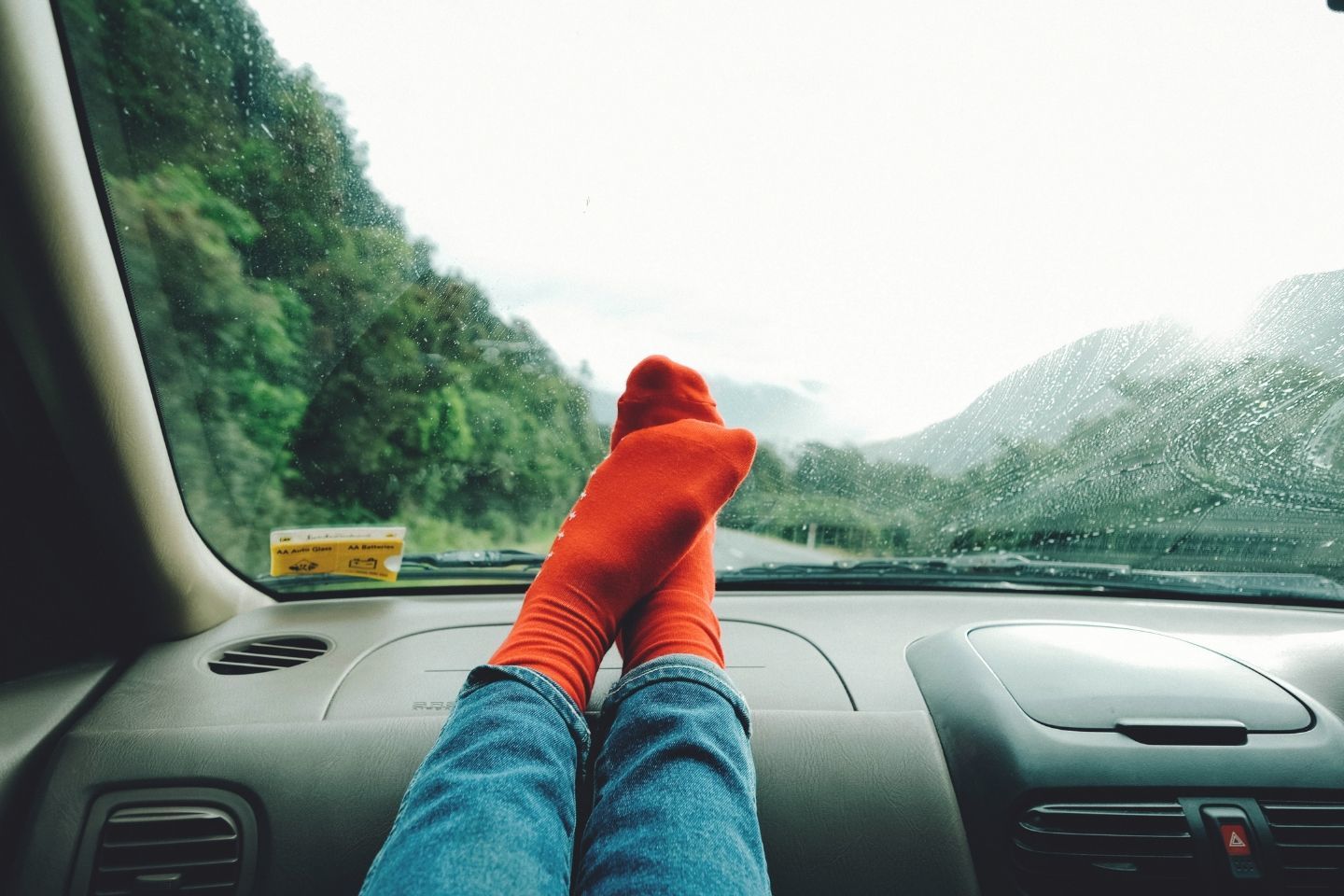 on a roadtrip feet in dashboard