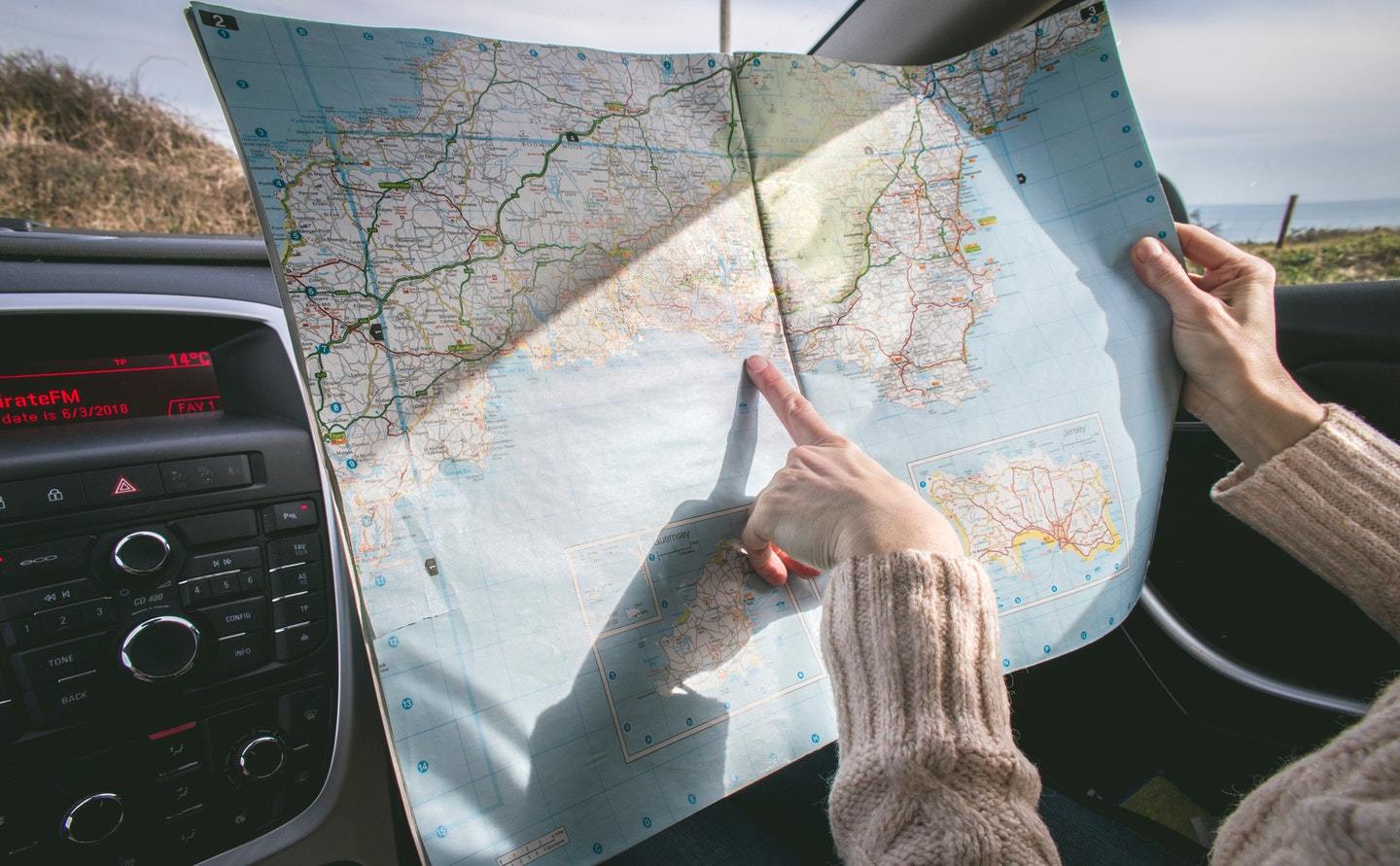 road trip looking at map