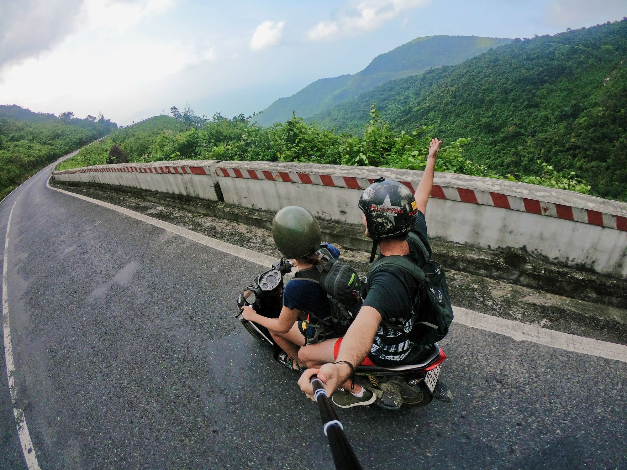 Two men riding on a motorcycle