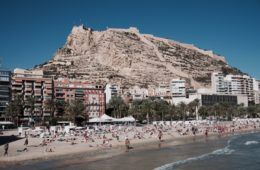 beach surrounded by mountain and buildings in alicante spain