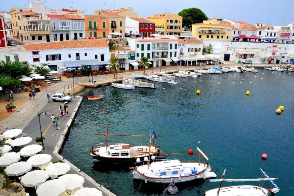 water, boats, colorful houses and a promenade