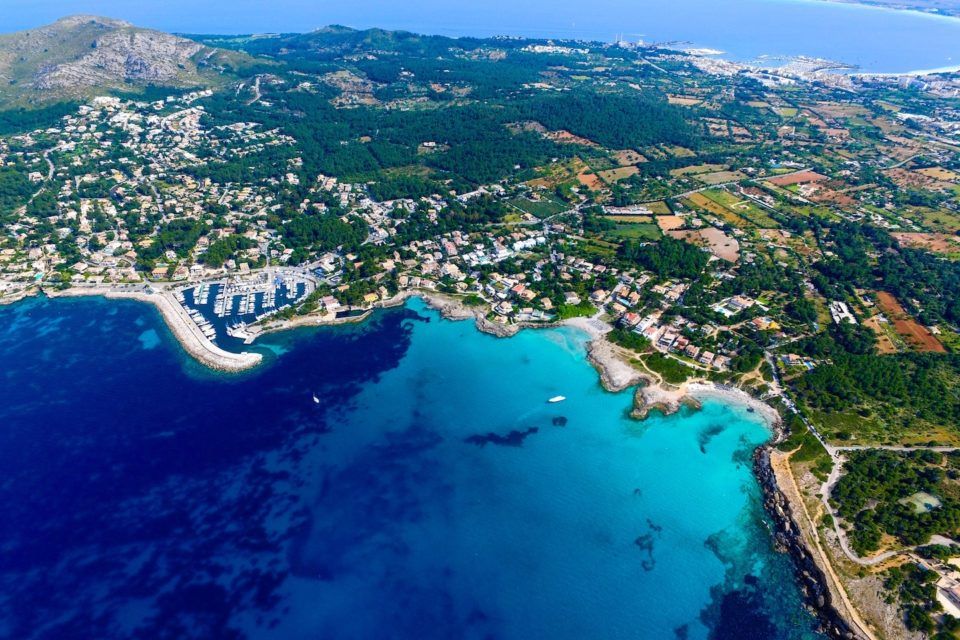 aerial view of island surrounded by blue water