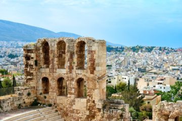 View of ancient ruin and Athens city in Greece