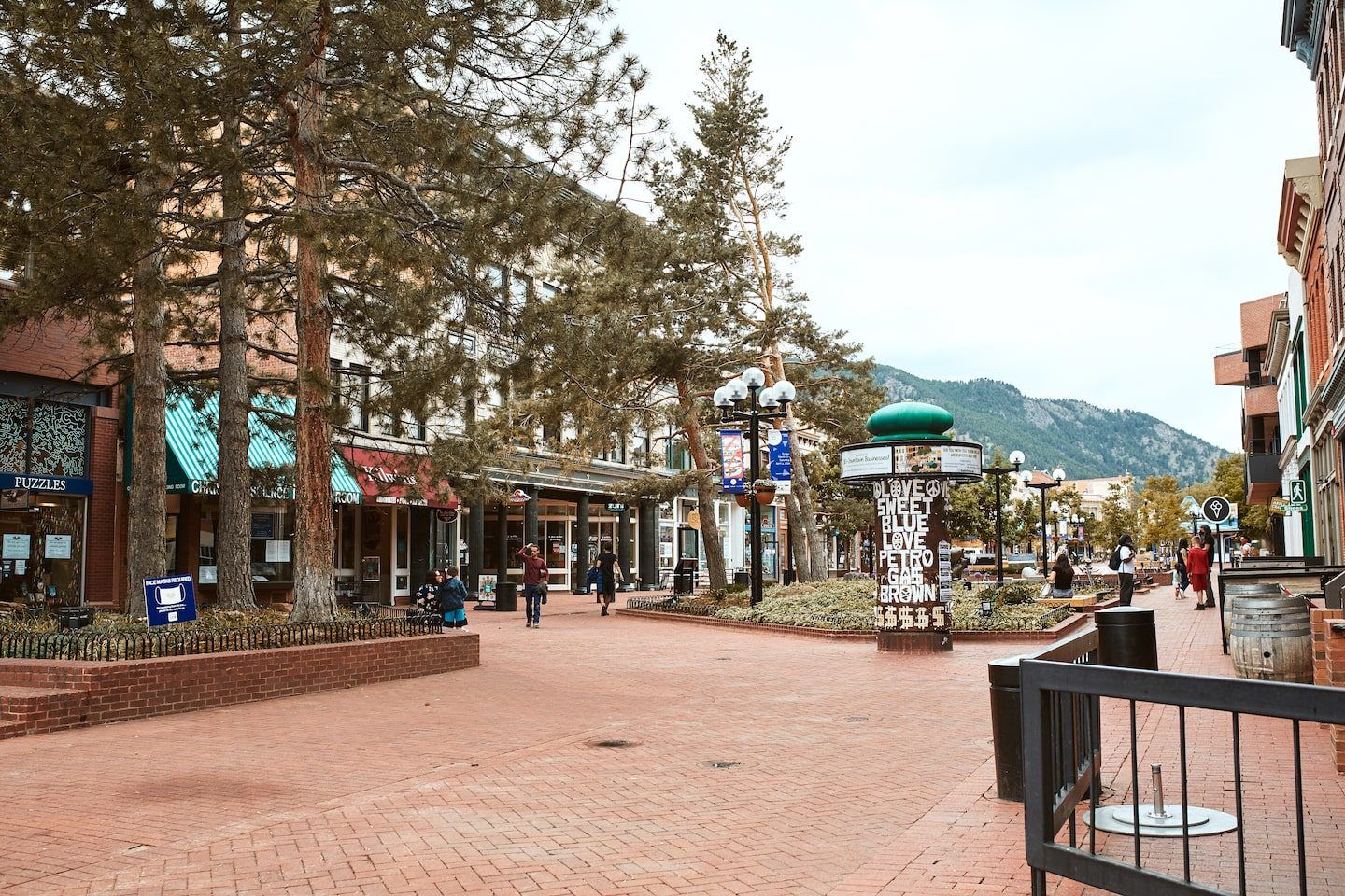 Downtown Boulder Colorado Pearl Street with mountains in the background
