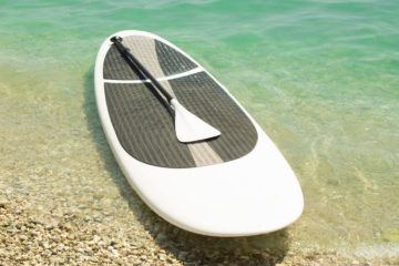 White Paddle Board on a shore