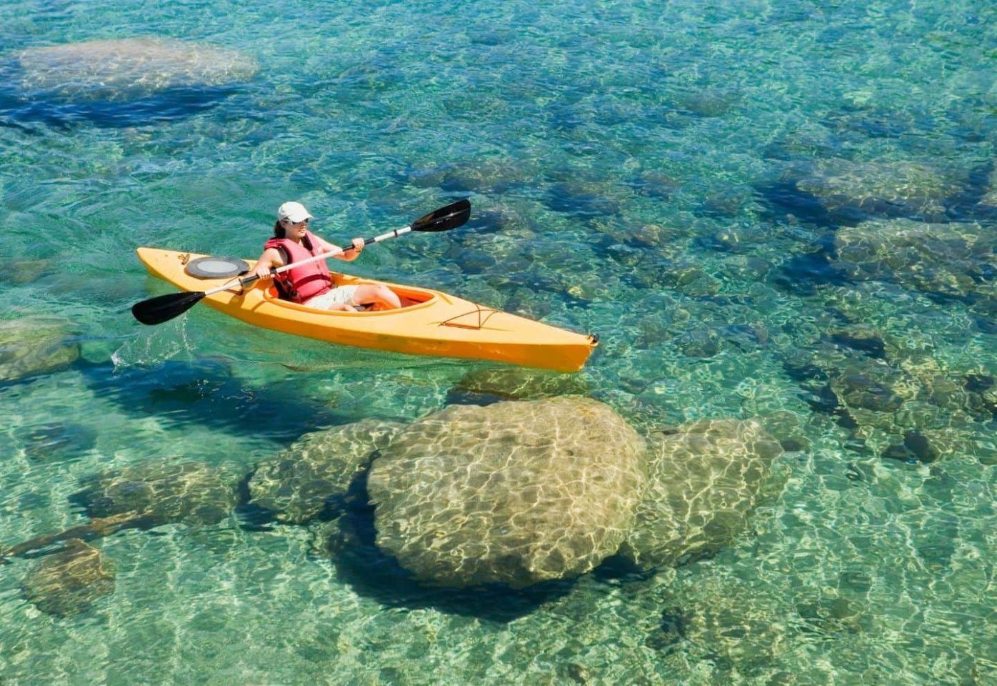 Mid adult woman kayaking