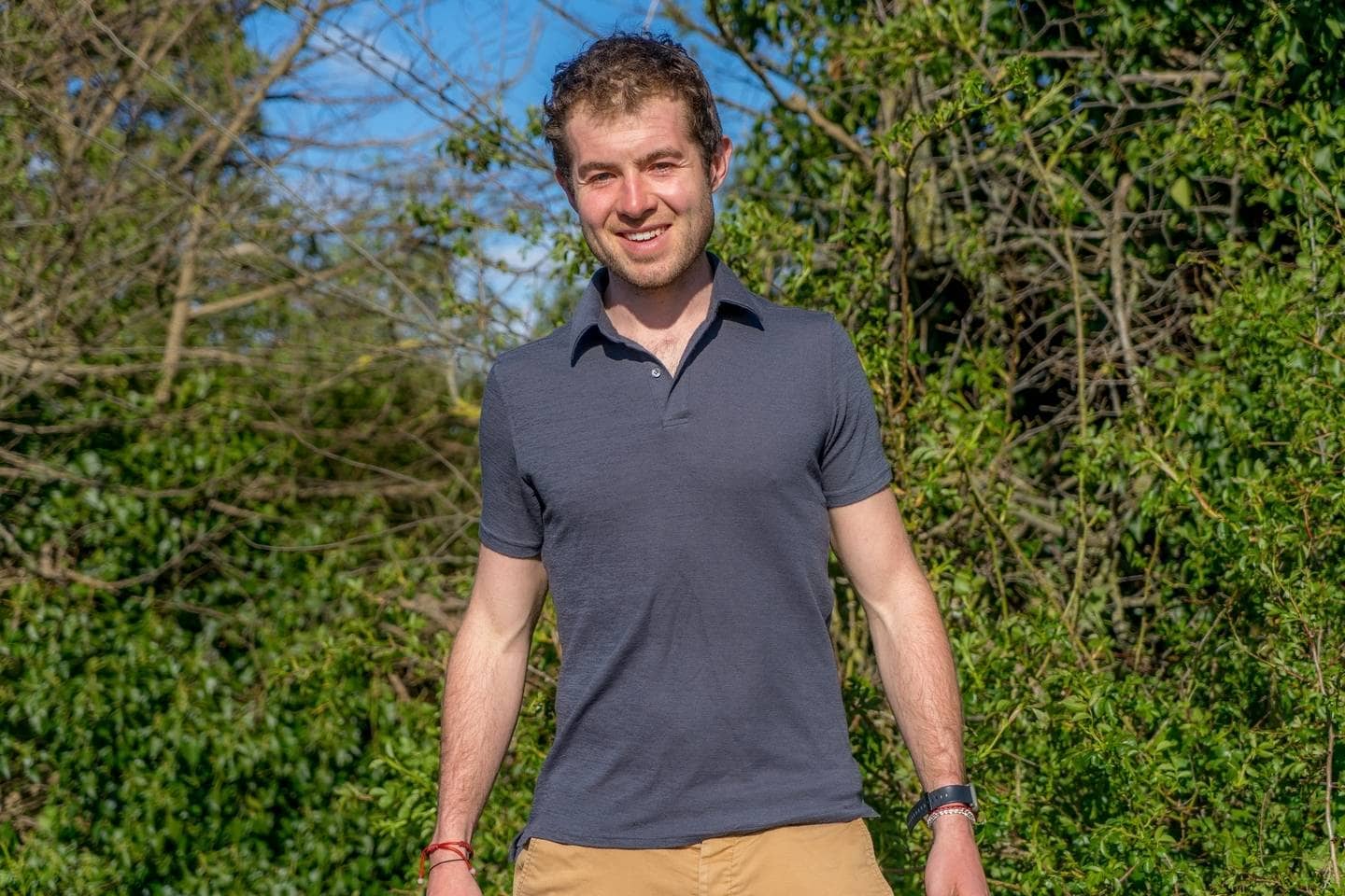Author wearing Unbound Merino Polo in dusk