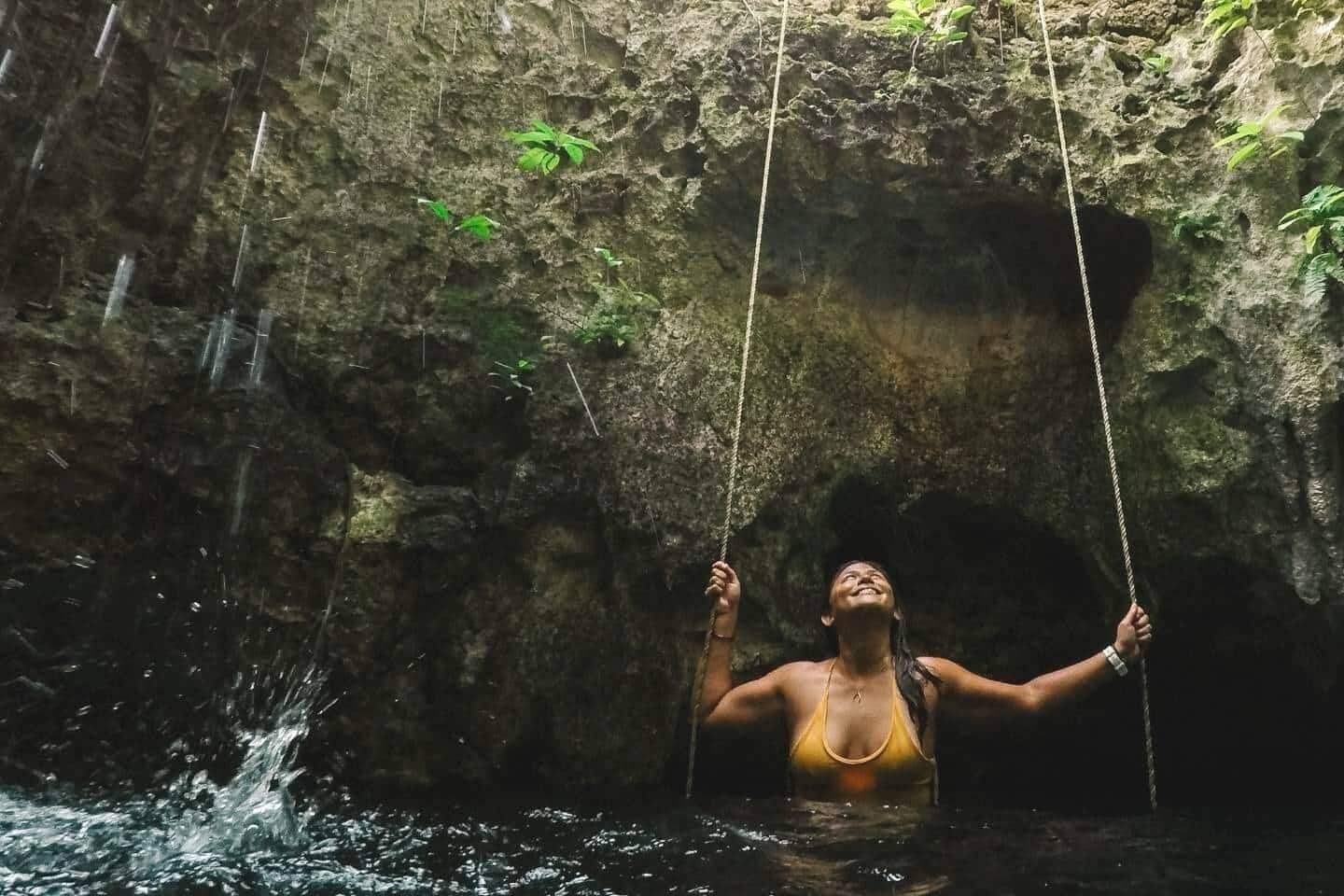 Anna, founder and editor of Adventure in You in a cenote